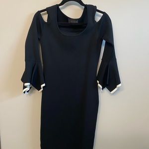 Frank Lyman Designer Black Dress with Peak-boo shoulders and bell sleeves.